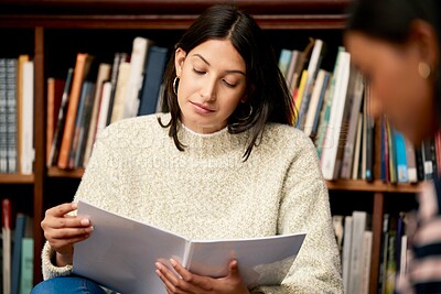 Buy stock photo University, books and women at campus library for reading research, project or homework. College, education and gen z students with notebook for classroom assessment, help or learning with support