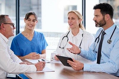 Buy stock photo Meeting, tablet and team of doctors with collaboration for healthcare talk and telehealth app in office. Surgeon group, tech and medical discussion with website for hospital funding or sponsorship