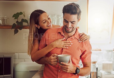 Buy stock photo Happy, in love and carefree couple embracing, bonding and being affectionate at home together. Young boyfriend and girlfriend hugging, relaxing, talking, being playing and enjoying their relationship