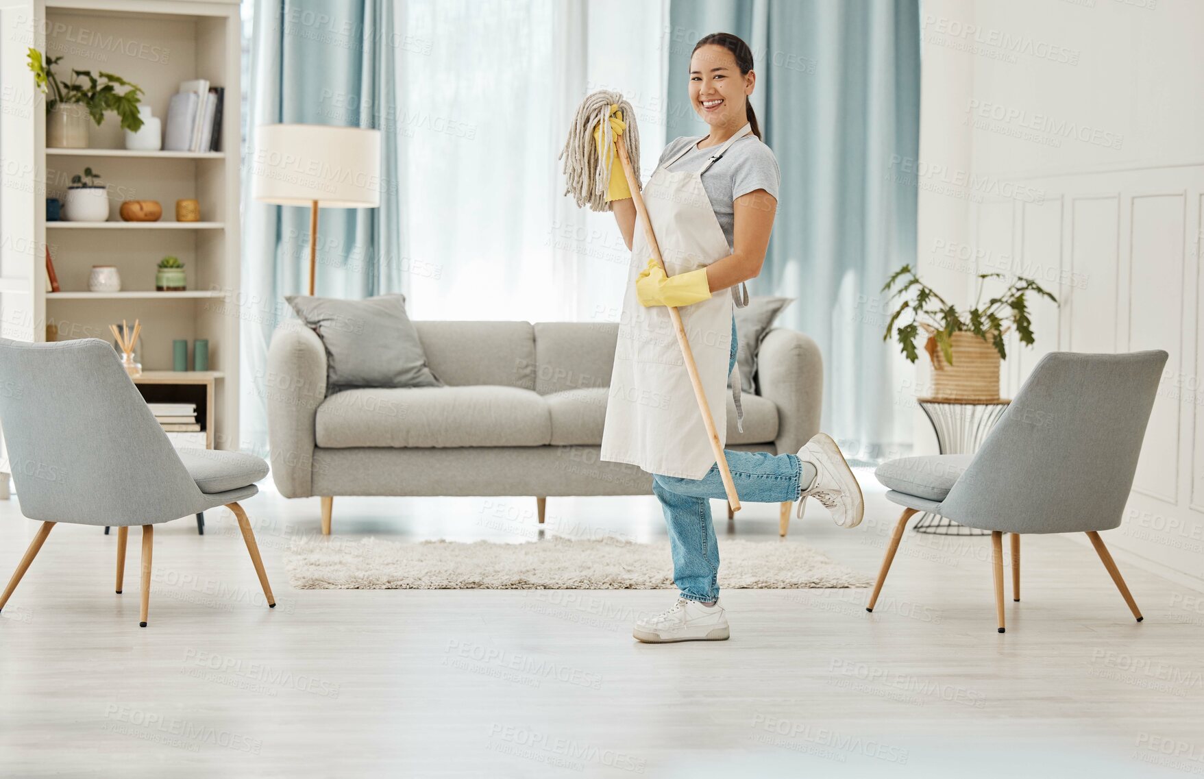 Buy stock photo Cleaning, chores and hygiene with a woman cleaner or domestic worker with a mop in a house to clean, tidy and wash. Housework, hygienic and sanitizing with a young female in a home living room