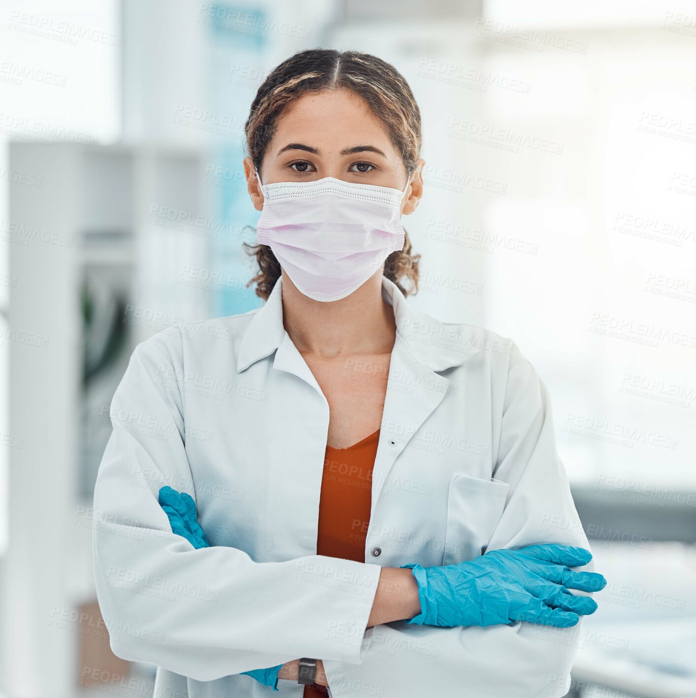 Buy stock photo Covid, medical and trust with doctor and arms crossed with a face mask in hospital for innovation, support or vision. Medicine, trust and leadership with portrait of healthcare employee in clinic