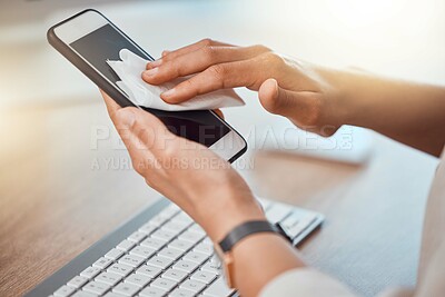 Buy stock photo Clean, office and woman hands cleaning phone screen with wet wipes for hygiene, cleaniness and disinfection of bacteria, virus or coronavirus. Closeup female hands wiping smartphone at office desk
