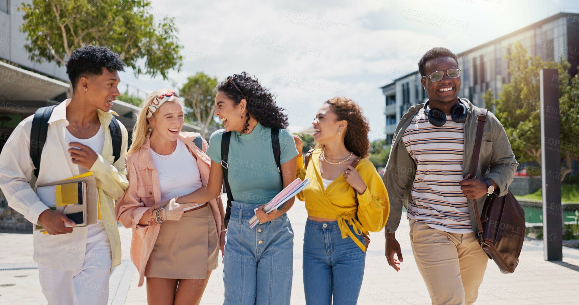 Buy stock photo Happy, university and conversation with friends and class diversity on college campus with smile. School, education and students with joke and backpack outdoor at learning academy with people