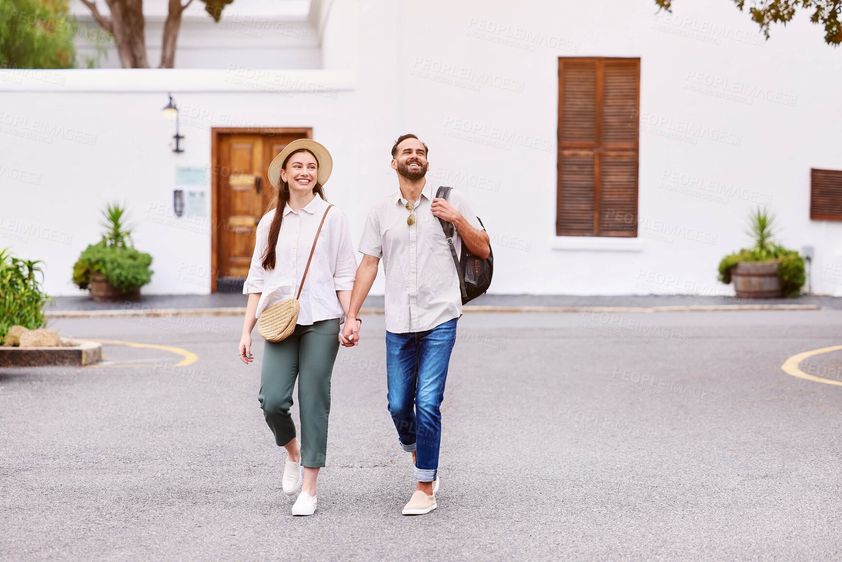 Buy stock photo Travel, walking and couple holding hands in street for sightseeing, summer vacation or adventure in city. Love, holiday and tourist man with woman with happiness for date, trip or explore in Greece