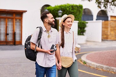 Buy stock photo Smile, couple and tourist with camera outdoor for adventure, sightseeing and walking with holding hands. Man, woman and equipment for photography on tour, cultural experience and travel documentation