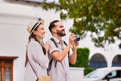 Buy stock photo Happy, couple and travel with camera outdoor for adventure, sightseeing and together on holiday. Man, woman and equipment for photography on tour, cultural experience and tourist documentation.
