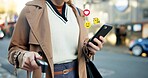 Woman, hands and icons with phone in city for travel, social media or communication on sidewalk. Female person, user or traveler with luggage on mobile smartphone for trip or network in an urban town