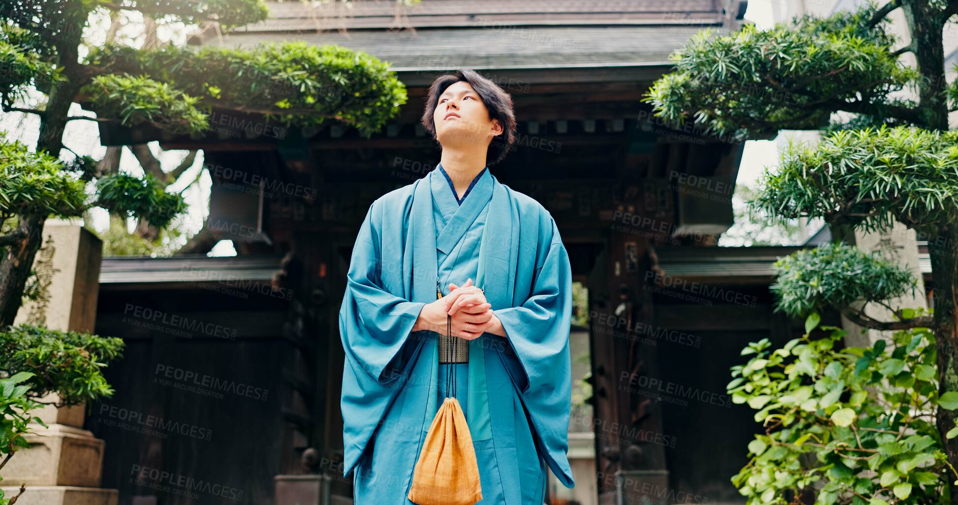 Buy stock photo Kimono, thinking and low angle with Japanese man at temple for Shinto ceremony, fashion and prayer. Respect, travel and reflection with person in japan for traditional clothes, Buddhism and festival