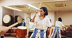 Japanese drums, teacher or people in studio, music and rehearsal for festival. Group, instruments and women in class, stage creativity or hobby with song, Taiko or playing with beat, talent or rhythm