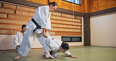 Buy stock photo Karate, self defense and submission with people in dojo for demonstration, fitness or training. Challenge, martial arts or technique with Sensei and student in Japan for combat, fighting or sports