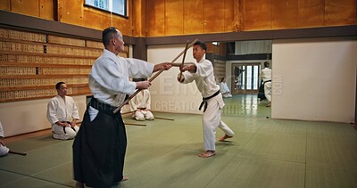 Buy stock photo Action, fitness and training for martial arts, people and sensei with students, fighting and strong. Class, learning and active for self defence, technique and fighter with weapon, samurai and Japan