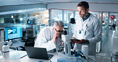 Buy stock photo Medical, microscope and science with people in laboratory together for breakthrough or development. DNA, laptop and tablet with research team in clinical trial for cure, discovery or sample analysis