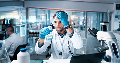 Buy stock photo Chemical, man and scientist with beaker and dropper in laboratory for pharmaceutical experiment or research. Liquid, glass and male medicinal chemist with formula for reaction observation with cure.