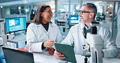 Buy stock photo Laughing, science and tablet with people in laboratory together for breakthrough or development. Funny, laptop and microscope with happy research team in medical trial with humor or satisfaction