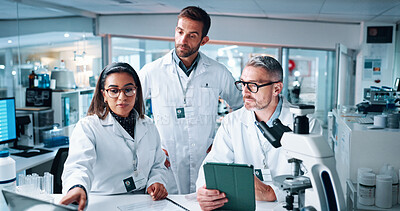 Buy stock photo Pointing, science and tablet with people in laboratory together for breakthrough or development. Collaboration, laptop and microscope with medical research team in clinical trial for discussion