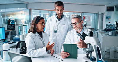 Buy stock photo Discussion, science and tablet with people in laboratory together for breakthrough or development. Conversation, laptop and microscope with professional research team in clinical trial for discovery