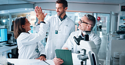 Buy stock photo High five, science and tablet with people in lab together for breakthrough, development or success. Celebration, laptop and microscope with happy research team in clinical trial for goals or target