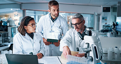 Buy stock photo Collaboration, science and teaching with people in laboratory together for breakthrough or development. Laptop, microscope or tablet and research team with mentor in clinical trial for medical study
