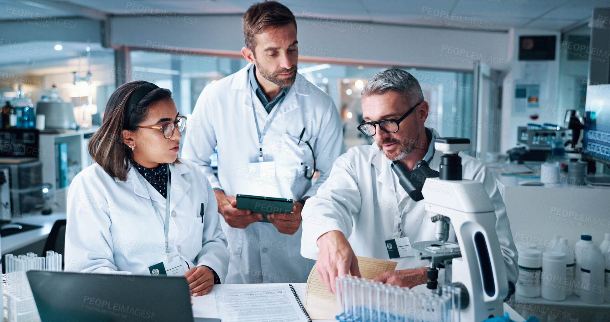 Buy stock photo Collaboration, science and teaching with people in laboratory together for breakthrough or development. Laptop, microscope or tablet and research team with mentor in clinical trial for medical study