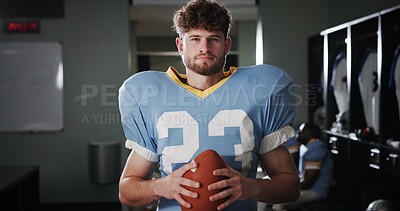 Buy stock photo Athlete, football player or ball in locker room for portrait, protective gear or quarterback in tournament. National sport, serious or man in cloakroom for fitness, game confidence or safety in USA