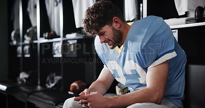Buy stock photo Football, player and man with phone in locker room for text message, check notifications and match break. Sports, athlete and relax with smartphone for social media scroll, online news or mobile chat