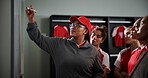 Women, coach and meeting with soccer team on whiteboard for match or game plan in locker room. Female people, coordinator or teaching with presentation for player formation or sport strategy together