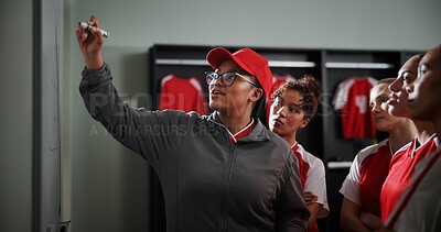 Buy stock photo Women, coach and meeting with soccer team on whiteboard for match or game plan in locker room. Female people, coordinator or teaching with presentation for player formation or sport strategy together