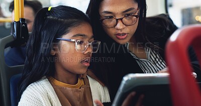 Buy stock photo Bus, mother and child with tablet for commute, connection and reading online with conversation for trip. Public transport, mom and girl with technology for streaming app, educational game and travel
