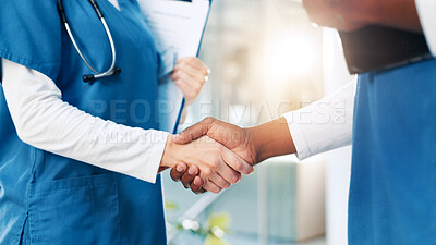Buy stock photo Hospital, nurses and people with handshake for welcome, teamwork or motivation in clinic for deal. Closeup, employees or partnership with shaking hands for medical, thank you or support in healthcare