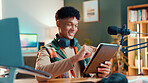 Man, streamer and tablet in home with mic, typing and smile with script editing for video production. Influencer, happy and app for chat with fans, click or subscription list on social media at house