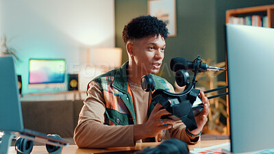 Buy stock photo Man, influencer or gamer streaming with vr goggles for online tutorial or guide at home. Male person, freelancer or caster talking with technology or mic for audio podcast, tips or gaming review