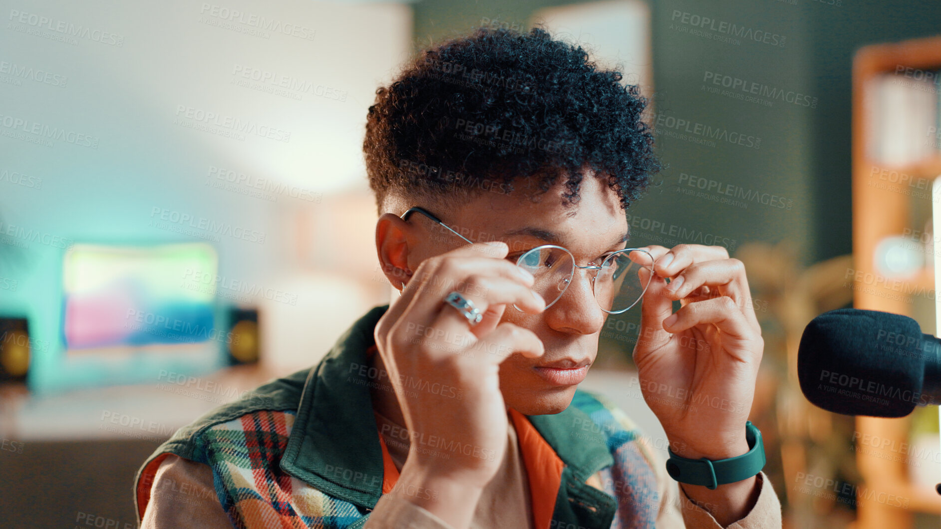Buy stock photo Serious, podcaster and man with glasses, mic or ready for live streaming of interview or production. Studio, content creator and person with tech for podcast, broadcast and hosting of talk show