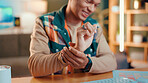 Man, hands and designer with wrist pain for carpal tunnel syndrome or overworked muscle at home. Male person, sore arm or injury with discomfort for strain, pressure or joint inflammation at house