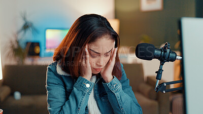 Buy stock photo Girl, headache and mic for live stream, stress and tired with eyes closed for brain fog at apartment. Gen z woman, influencer and fatigue with migraine, pain or burnout for podcast recording in home