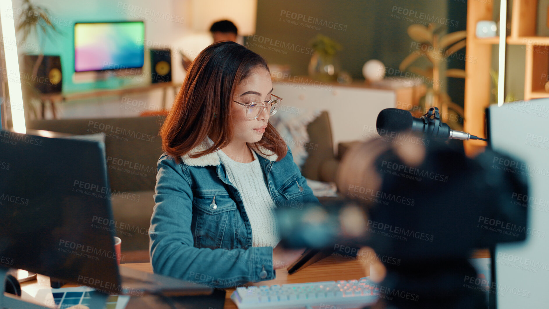 Buy stock photo Content creation, camera and woman in studio, mic and communication with influencer. People, house and social media with host, talk show and radio with podcast, connection and film equipment