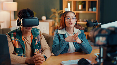 Buy stock photo Man, woman and influencer in home studio with mic, camera and vr headset for online talk show. Couple, recording equipment and augmented reality for web channel, podcast or social media at house