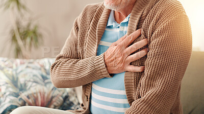 Buy stock photo Elderly man, hands and sofa with chest pain for medical emergency or cardiac arrest at home. Closeup, senior or male person with discomfort or lung disease for heartburn or heart attack at house