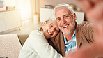 Senior, happy couple or hug with selfie on sofa for picture, photography or memory together at home. Elderly man, woman or lovers with smile in relax on couch for capture moment, embrace or love