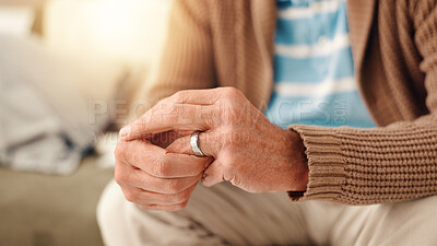 Buy stock photo Hands, home and old man with doubt, ring and toxic relationship with divorce, sad and confused. Pensioner, apartment and elderly person with closeup, frustrated and conflict with anxiety and crisis