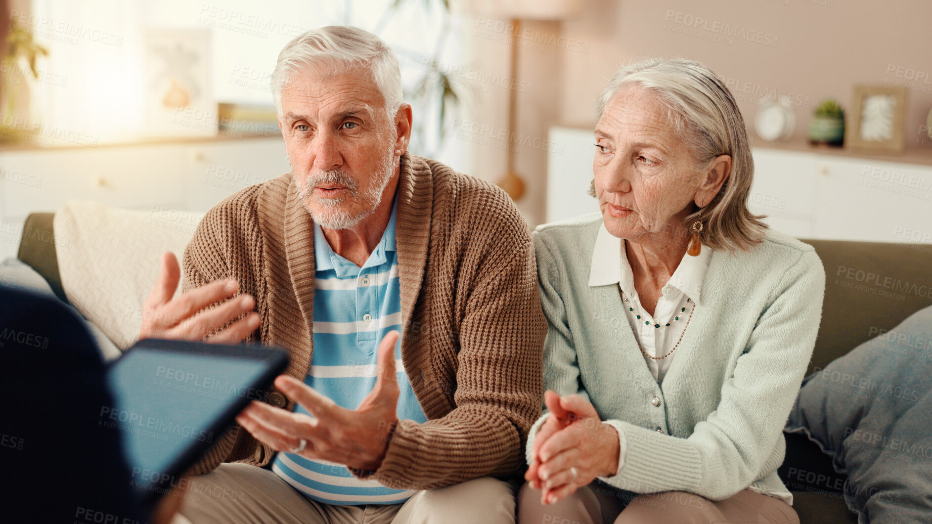 Buy stock photo Elderly couple, consultation or therapist with tablet on sofa for therapy session or counseling. Senior, man and woman talking with counsellor for communication or discussion at retirement home