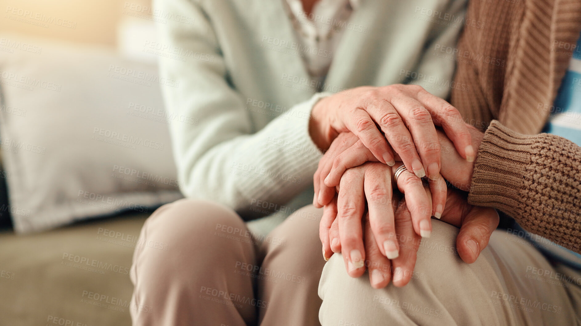 Buy stock photo Holding hands, closeup and senior couple on sofa for comfort, empathy and support together. Retirement home, marriage and mature man with woman on couch for care, help and compassion in living room