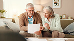 Senior couple, finance and discussion with documents on sofa for budget, expenses or bills at home. Elderly, man and woman with paperwork for financial planning, mortgage invoices or pension fund