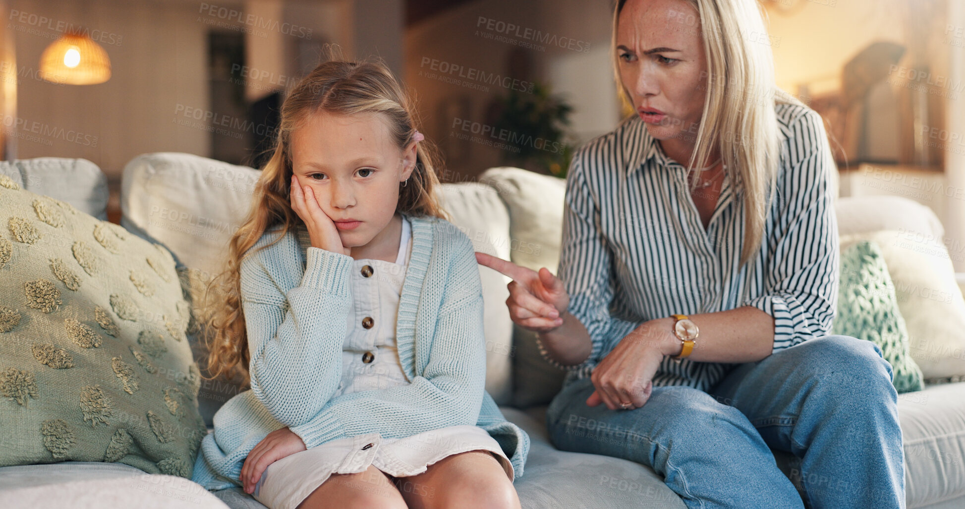 Buy stock photo Girl, sad and ignore mom on sofa with discussion, questions and discipline in lounge for behavior. People, mother and child in living room with mental health, conversation and point at family house
