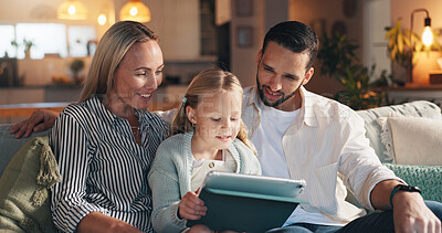 Buy stock photo Home, parents and girl with tablet, smile and bonding together with online entertainment. Happy family, apartment and mother on sofa, father and daughter with tech, social media and help with app