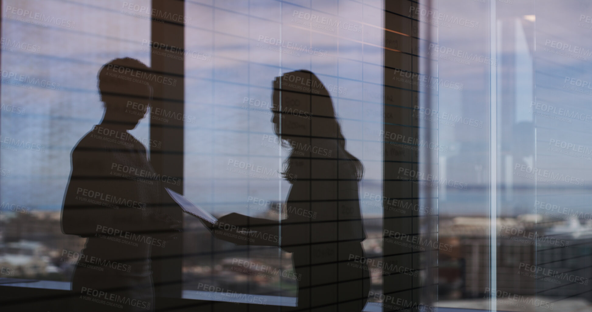 Buy stock photo Discussion, shadow and business women in office by window with documents for finance report. Meeting, paperwork and silhouette of female financial advisors with company budget planning in workplace.
