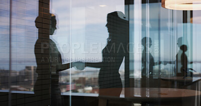 Buy stock photo Business people, handshake and silhouette at office, window and congratulations for promotion. HR consultant, employee and shaking hands with deal, welcome or thank you with support at finance agency