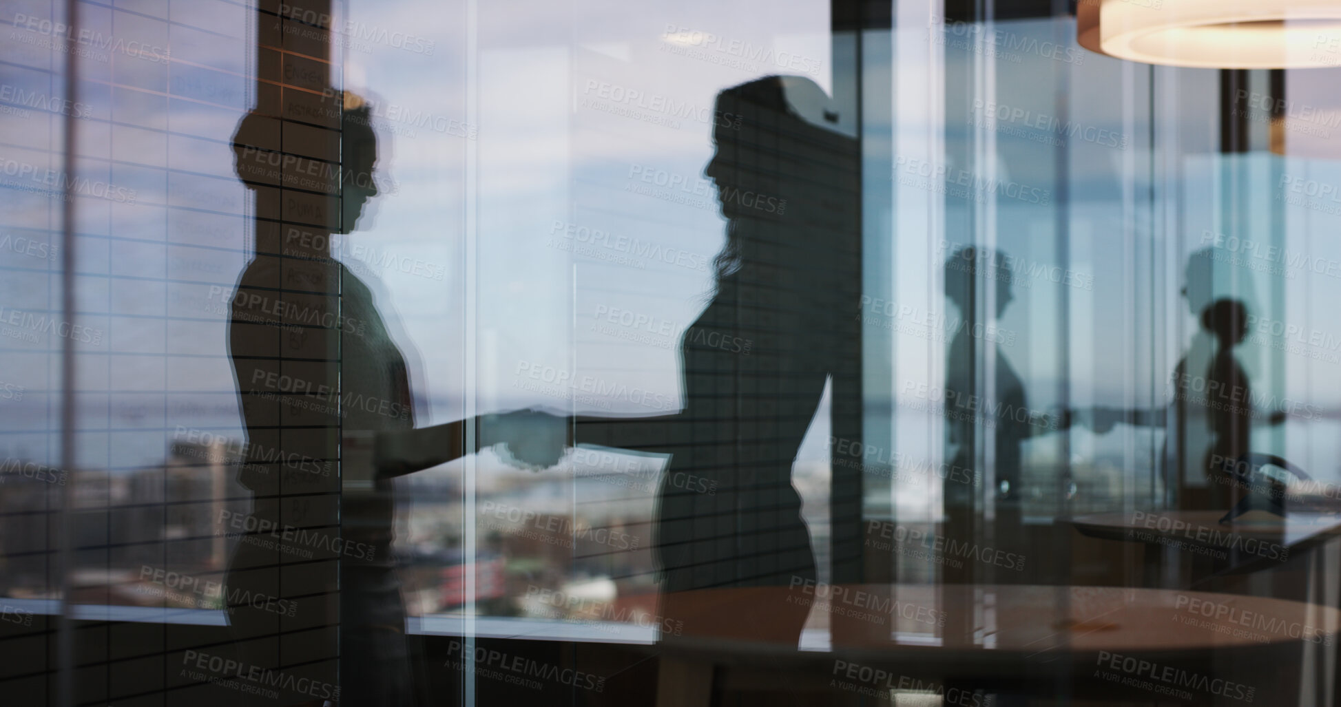 Buy stock photo Business people, handshake and silhouette at office, window and congratulations for promotion. HR consultant, employee and shaking hands with deal, welcome or thank you with support at finance agency