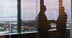 Silhouette, handshake and welcome with business people in office for contract, deal and thank you. Partnership, shaking hands and window with employees in agency for teamwork, support and opportunity
