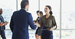 Conference, welcome and handshake with business people together with document for event. Greeting, man and woman shaking hands with employee for introduction to corporate seminar, office or workshop