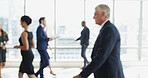 Blur, busy and moving with business people in lobby of office for corporate productivity. Walking, window and work with professional employee group in convention center for development seminar